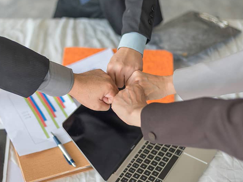 Teamwork Join Hands, Close-up of business partners making pile of hands at meeting, business concept.